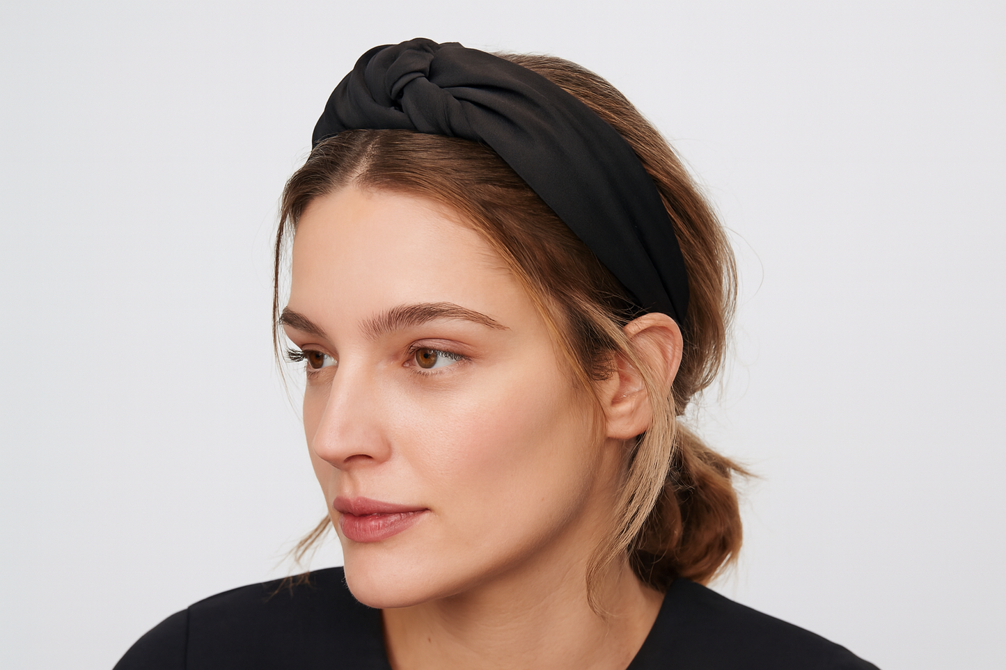 Model wearing black headband