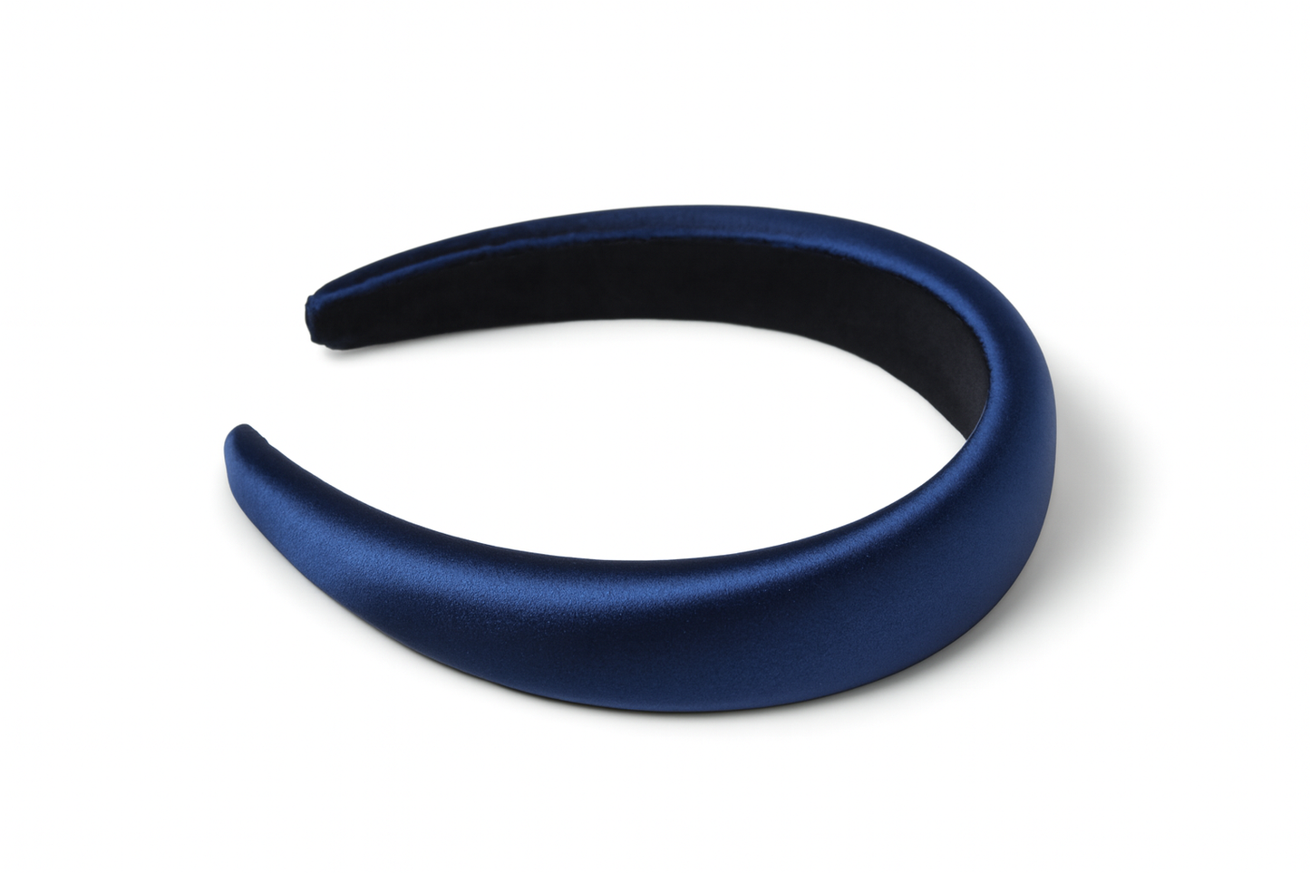 Navy blue padded headband on white background